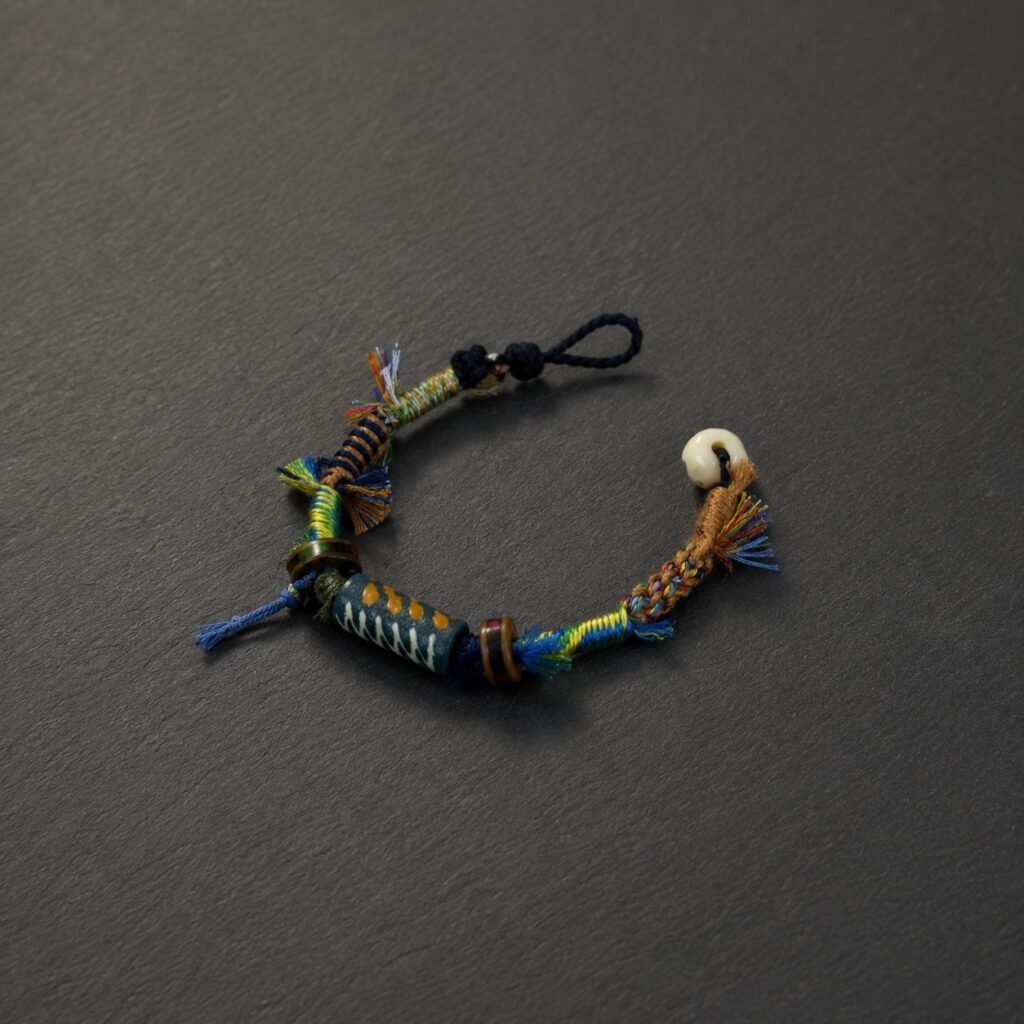 LHARI Kora Wind Protection Bracelet black background 45-degree view
