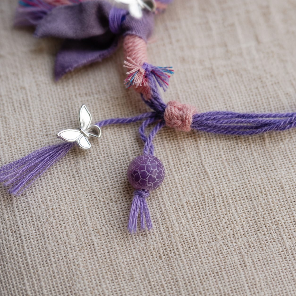 LHARI lilac butterfly prayer cord bracelet 05
